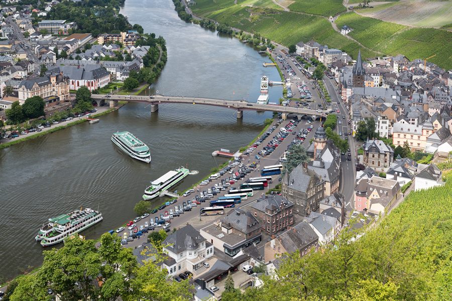 Cruise boats moored at a riverside town
